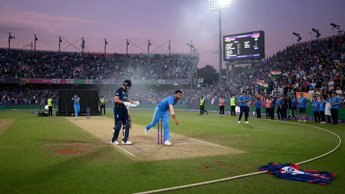 Wide night-time view of a packed cricket stadium with floodlights over a green outfield before a T20 international